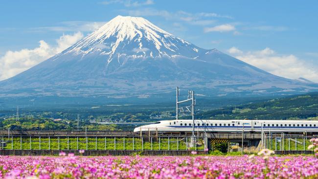 A bullet train passes Mt Fuji.