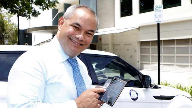 Gold Coast Mayor Tom Tate, using the Gold Coast City Councils parking app, PayStay. Picture: JERAD WILLIAMS