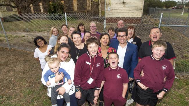 Josh Bull at the old Sunbury VU/asylum site with happy parents, students and staff from the Sunbury and Macedon Rages Specialist School.