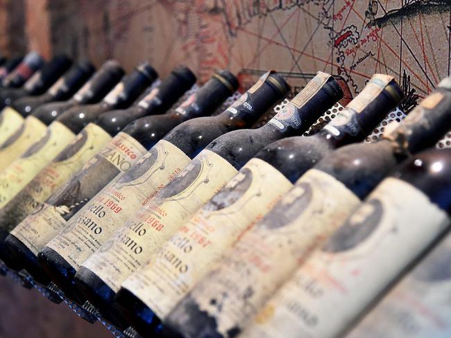 A photo taken on April 10, 2016 shows bottle of wines displayed during the 50th edition of the Vinitaly wine exhibition in Verona. Vinitaly is the world’s largest wine event, hosting more than 4164 exhibitors, looking to promote a vast range of rich and exotic varieties of wines, spirits and other alcoholic beverages. / AFP PHOTO / VINCENZO PINTO