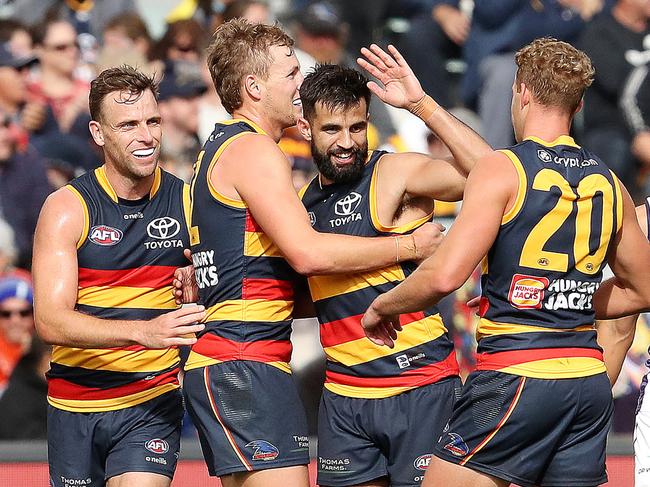 Jordan Dawson of the Crows and Wayne Milera celebrate a goal. (Photo by Sarah Reed/AFL Photos via Getty Images)