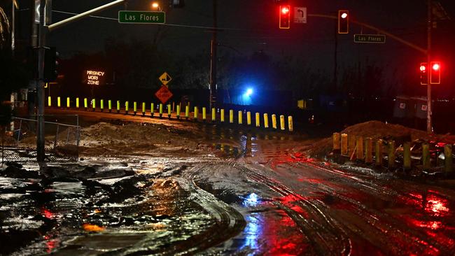 Mud covers the Pacific Coast Highway near the Palisades Fire zone as a storm swept through Malibu, California. Picture: Agustin Paullier / AFP