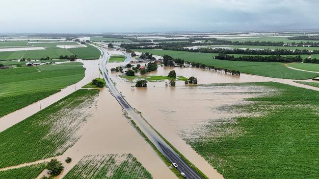 A monsoonal tropical low pressure system has bought devasting widespread flooding to North Queensland and parts of Far North Queensland, with over 700 millimetres of rain recorded in some areas and more wet weather forecast for the region. Flood water covers the Bruce Highway at Euramo, south of the Tully River, the furthest south the Far North Queensland residents can currently travel by road. Picture: Brendan Radke