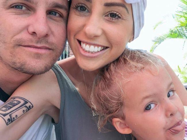 Gold Coast family Megy and Justin Gough with daughter Harper. The couple are raising money to keep fighting stage 4 bowel cancer so Megy can watch Harper grow up.