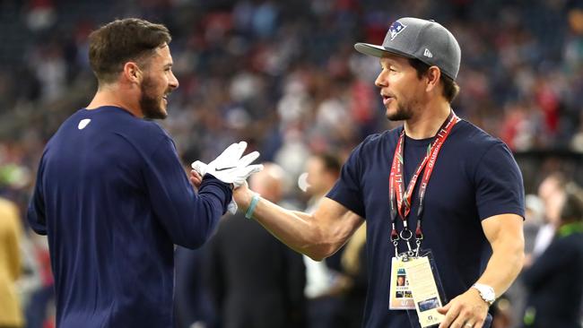 Danny Amendola of the New England Patriots speaks to actor Mark Wahlberg prior to Super Bowl 51. Photo by Al Bello/Getty Images.