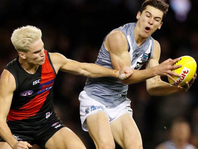 Port’s Connor Rozee marks ahead of Essendon’s Matt Guelfi on Saturday. Rozee kicked 2.5 for Port. Picture: MICHAEL WILLSON/AFL PHOTOS VIA GETTY IMAGES