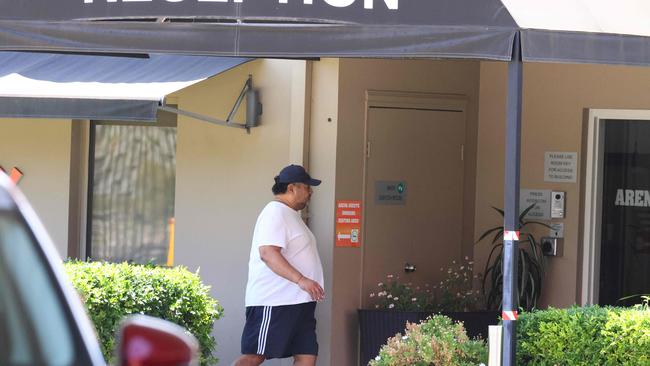 An unidentified man outside the Arena Hotel in Chullora, where detainees have been temporarily housed after the high court ruled that indefinite detention was illegal.