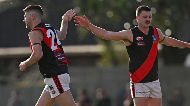 Pascoe Vale’s Michael Ross (left) celebrates one of his two goals. Picture: Andy Brownbill