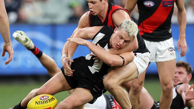 Jake Kelly appears to take Ginnivan high in another tackle. Picture: Mark Stewart