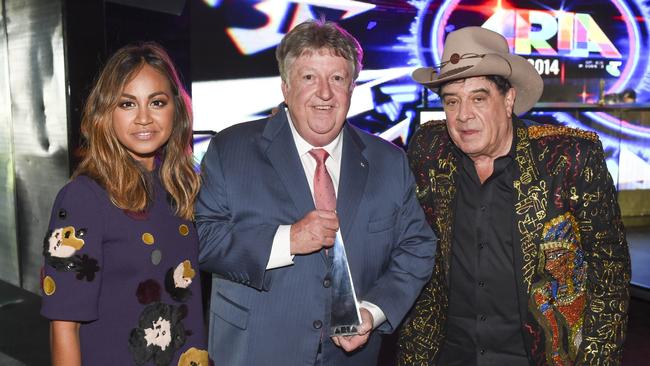 Former Sony Music Australia CEO Denis Handlin (centre) with pop singer Jessica Mauboy and Molly Meldrum at the ARIA Awards in Sydney on November 26 2014, after Handlin had been presented with an ‘industry icon’ award.