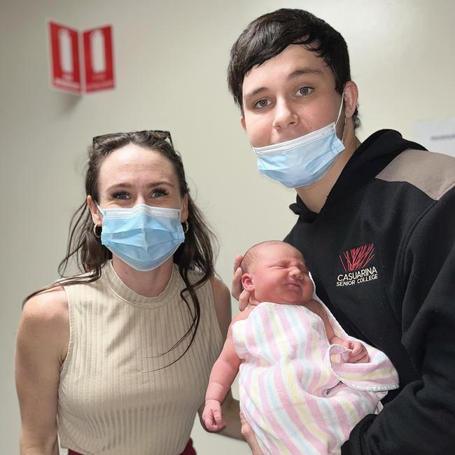 18-year-old Kingsley 'Junior' Alley holding his newborn daughter Eleanor, with stepmum Kylie Simmonds. Kingsley was allegedly murdered at Palmerston on October 8.