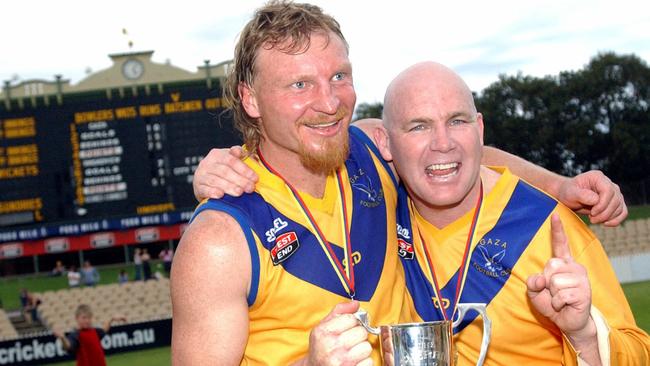 Former Crows teammates Wayne Weideman and Andrew Jarman after winning the 2003 division one premiership with Gaza.