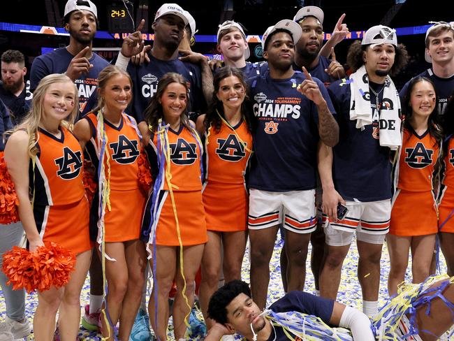 NASHVILLE, TENNESSEE - MARCH 17: The Auburn Tigers celebrate after defeating the Florida Gators in the SEC Tournament Championship game at Bridgestone Arena on March 17, 2024 in Nashville, Tennessee. (Photo by Andy Lyons/Getty Images)