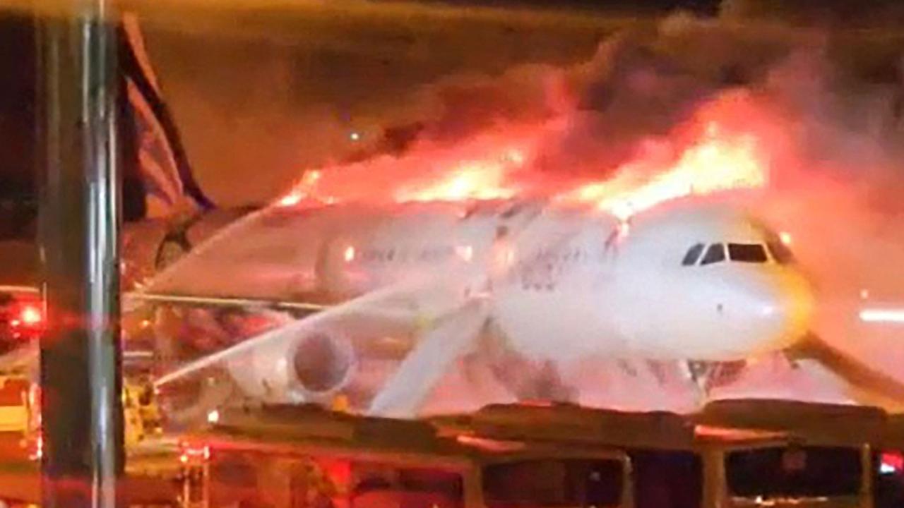 Plane with 176 people on board catches fire