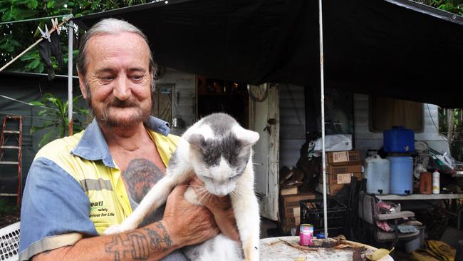 Long-term Humpty Doo caravan park resident Tony Thomson with his cat 'Bluey' Picture: Matt Garrick