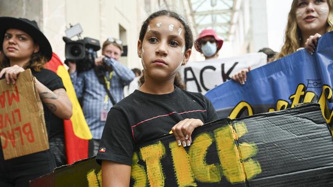 Protesters carried both pro-Palestinian and First Nations placards. Picture: NCA NewsWire / Martin Ollman