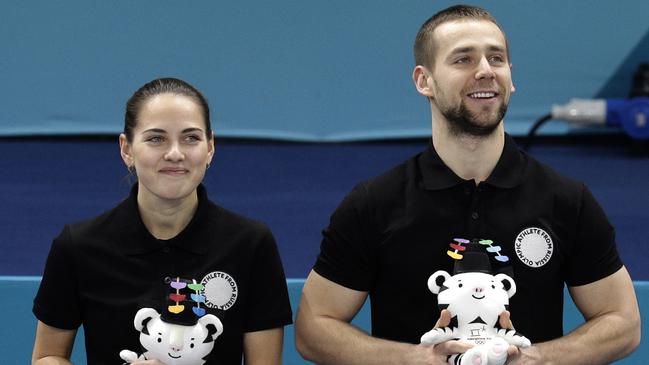 Alexander Krushelnitsky, right, with wife Anastasia Bryzgalova after finishing third in the curling mixed doubles in PyeongChang. Picture: AP.