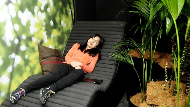 Taking a micro-nap in the rainforest-themed rest and relaxation room. Picture: John Appleyard