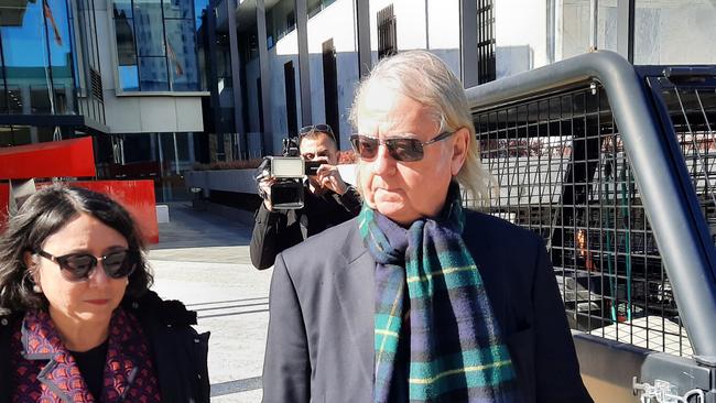 Roger Uren leaves the ACT Magistrates Court with his lawyer, Noor Blumer, after pleading guilty to breaching secrecy laws. Picture: Craig Dunlop