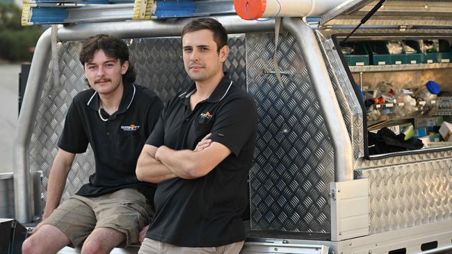 Apprentice James Simpson and electrician Alex Huebsch. Picture: Lyndon Mechielsen