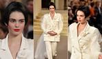 ALMOST unrecognisable in a bobbed wig Kendall Jenner stars in the star-studded Paris runway show, featuring a full house of A-list actors enjoying the casino-theme. Picture: Getty