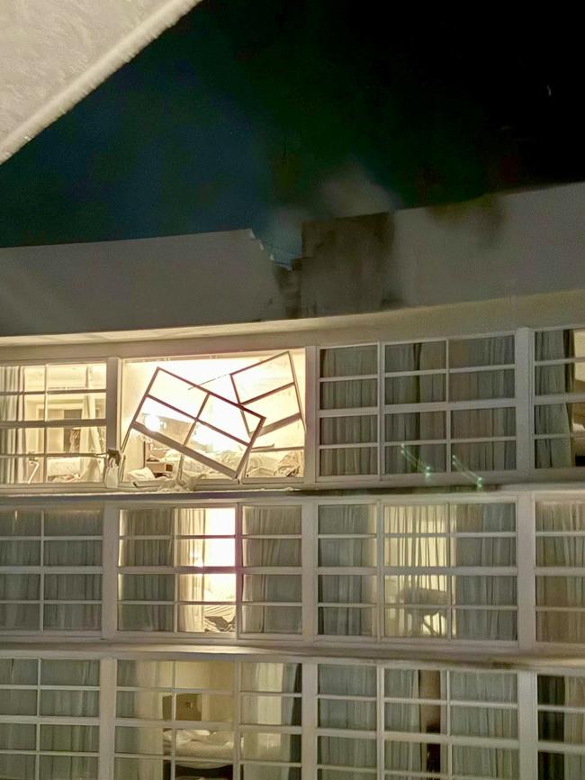 A man has died after a helicopter crashed into the roof of a Cairns hotel, with up to 400 people evacuated in the incident. Picture: Supplied