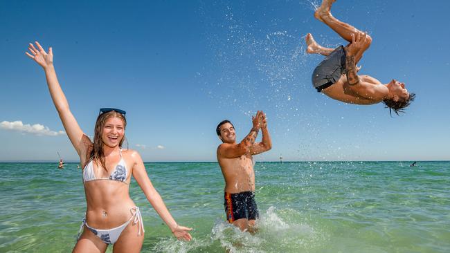 Housemates Helene Rapassanis, Luis Soto and Sam Plaisted enjoying Parkdale beach. Picture: Jason Edwards