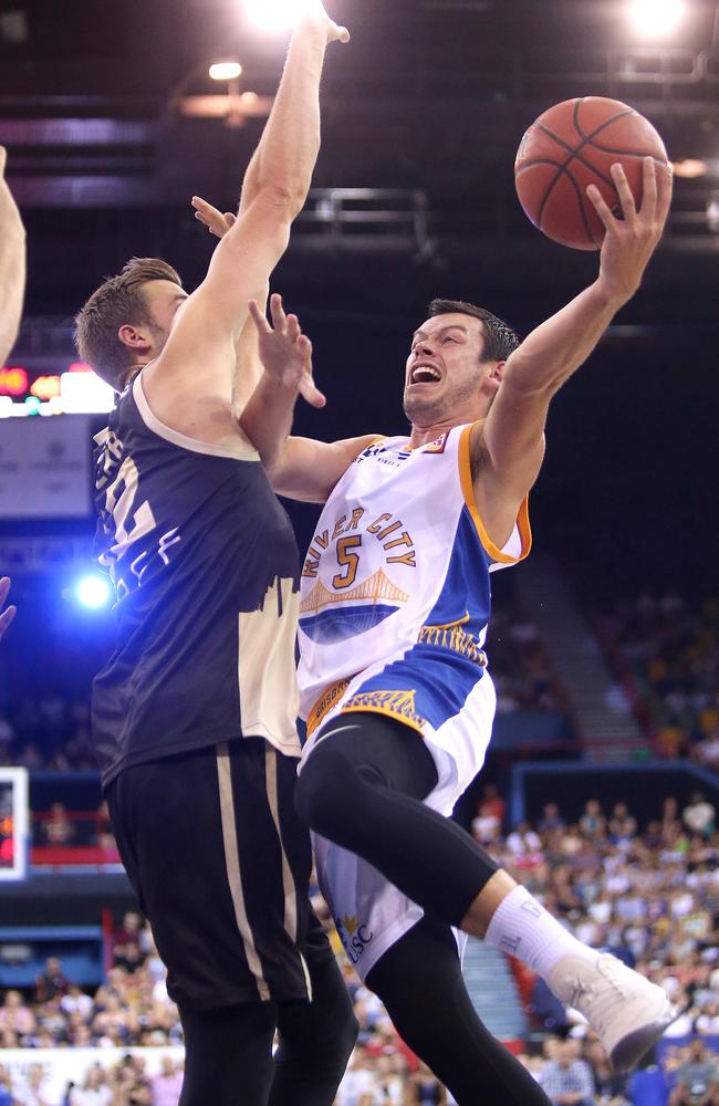 Bullet Jason Cadee meets an Andrew Bogut brick wall during his side’s loss. Picture: Getty Images