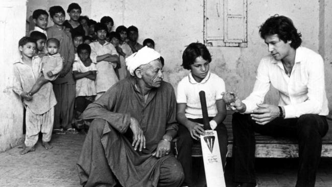 Imran Khan teaches Pakistani children the basics of cricket in 1983. 