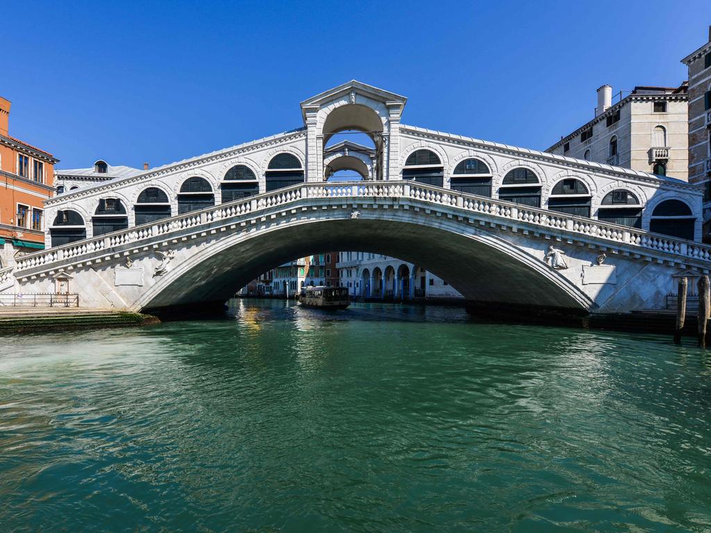 Venice’s Rialto Bridge is usually packed with tourists. Picture: ANDREA PATTARO / AFP