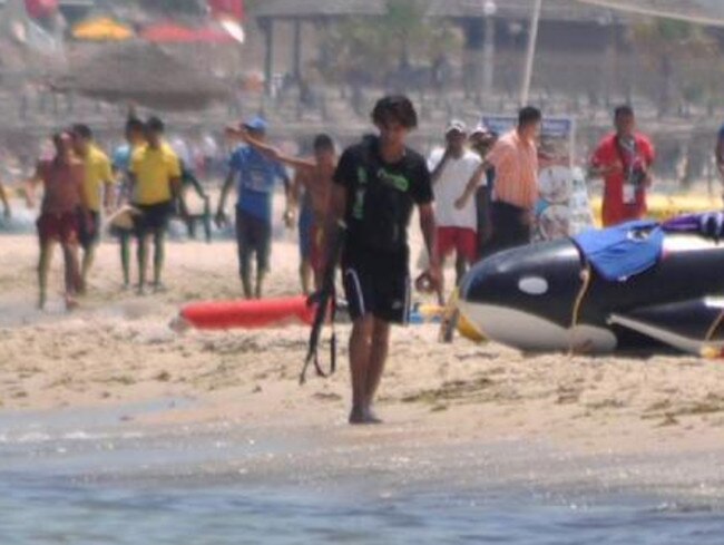 An Islamic State gunman on the beach at the resort town of Sousse in Tunisia. Picture: SkyNews/twitter