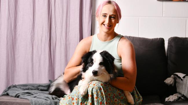 Madison Brown, 23, has completed a year of treatment for a rare form of ovarian cancer. Pictured with her 9m Border Collie Harley. Picture: Alix Sweeney