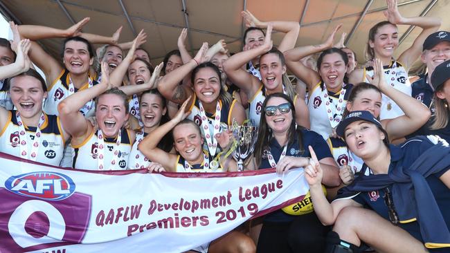 Bond University celebrate their QAFLW Development premiership. Coach Emma Williams holds the premiership cup (front right) Pic: Jason O'Brien