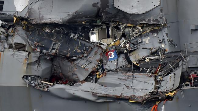 Damage to the guided missile destroyer USS Fitzgerald is seen as the vessel is berthed at its mother port in Yokosuka, southwest of Tokyo, on June 18, 2017. Picture: AFP PHOTO/Kazuhiro Nogi