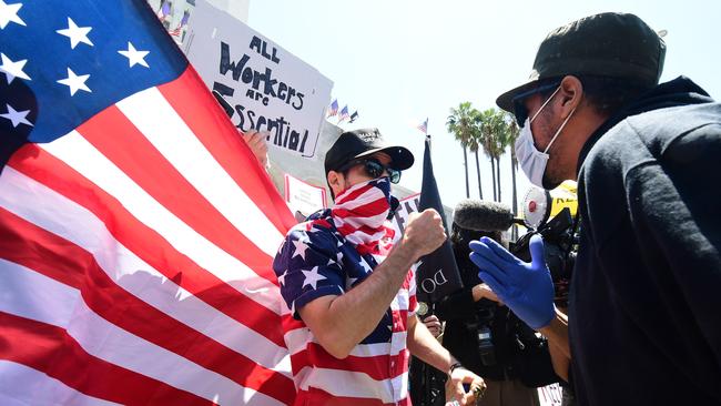 Clashes at a protest in Los Angeles to demand the end to California’s shutdown. Picture: AFP