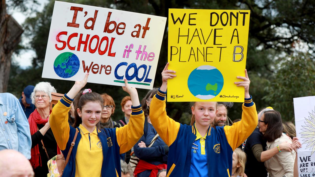 Student activists Jasmine Vogel, 12, and Olivia Mountain, 12, make their thoughts known at a climate emergency student strike in NSW in 2019. Picture: AAP Image