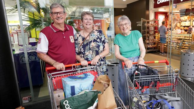 L to R, Andy and Jenny Andrews, and Jenny Boyd, at Coles in The Gap shopping centre, were shopping to stock up because of the threat of cyclone Alfred, some shelves were empty at supermarkets due to the cyclone - on Monday 3rd March 2025 - Photo Steve Pohlner