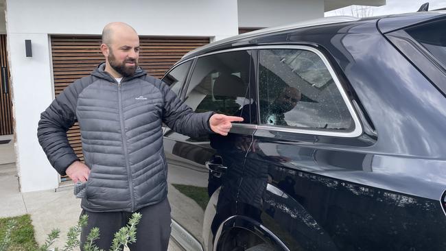 Housien Darwich points to where the bullet went through his car last night. Picture: Paul Brescia