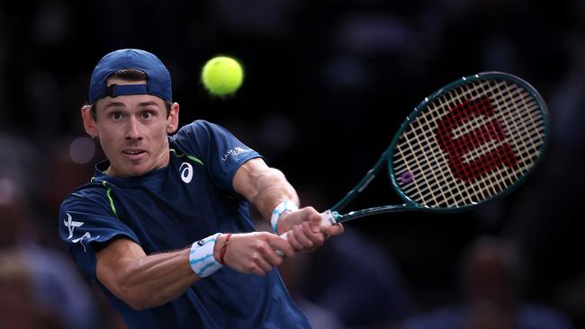 Alex De Minaur of Australia plays a backhand against Holger Rune at the Paris Masters.