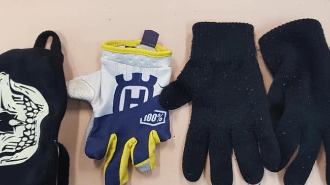 Police found gloves in the pockets of a man in a stolen vehicle at Jesmond. NSW Police.