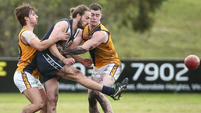 Liam Byrne gets a kick away for Avondale Heights. Picture: Hamish Blair