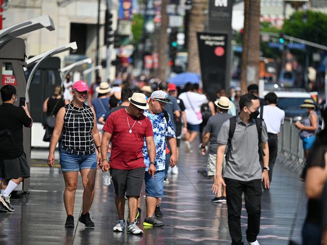 Tourists walk on Hollywood Boulevard's Walk of Fame, California as the United States lifts an 18-month-old travel ban on the European Union and Britain. Picture: AFP