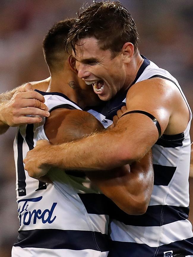 Tom Hawkins celebrates a goal with teammate Tim Kelly on Friday. Picture: Michael Willson. 