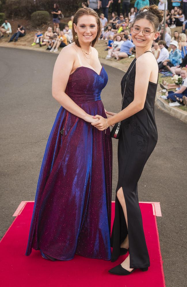 Reese Drury (left) and Kaitlyn Jerome at Harristown State High School formal at Highfields Cultural Centre, Friday, November 17, 2023. Picture: Kevin Farmer