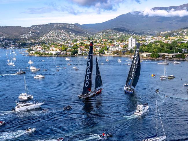 TOPSHOT - This handout image received from Rolex on December 28, 2023 shows yachts Law Connect and Andoo Comanche near the finish line of the annual Sydney to Hobart yacht race in Hobart. (Photo by Andrea Francolini / AFP) / RESTRICTED TO EDITORIAL USE - MANDATORY CREDIT "AFP PHOTO / ROLEX / ANDREA FRANCOLINI" - NO MARKETING NO ADVERTISING CAMPAIGNS - DISTRIBUTED AS A SERVICE TO CLIENTS - NO ARCHIVE