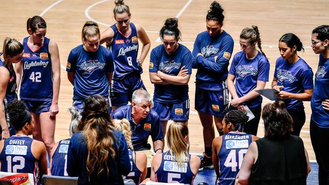 Adelaide Lightning players huddle around coach Chris Lucas in a match against Bendigo at Titanium Security Arena. Picture: AAP Image/ Morgan Sette)