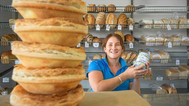 Dannielle Waters with some of the many pies that have been flying out the doors of Yamba Fair Bread Shop raising money for the SHINE program. Picture: Adam Hourigan