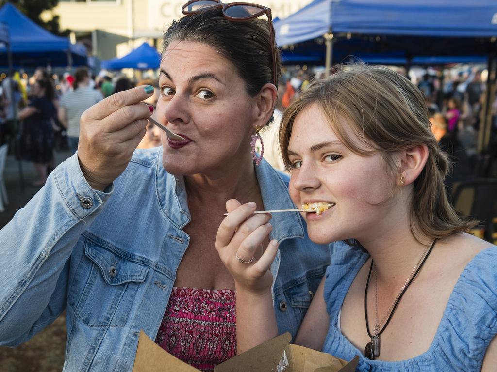 Kathleen (left) and Rikkie Moon enjoy a Swedish desert at Twilight Eats at the Windmills, Saturday, November 18, 2023. Picture: Kevin Farmer