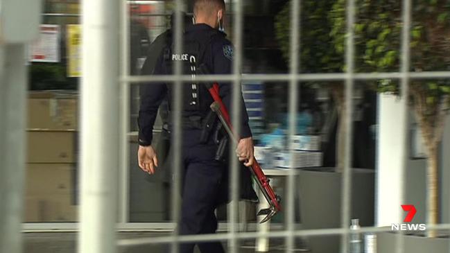 Police went into the medi-hotel with a battering ram and bolt cutters. Picture: 7 NEWS