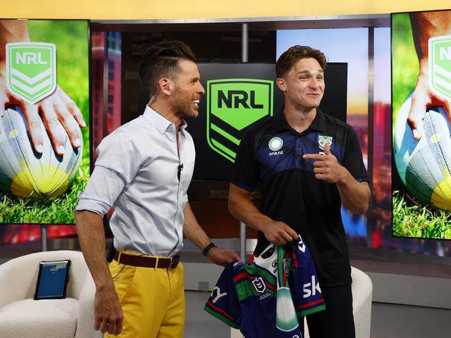 DAILY TELEGRAPH FEBRUARY 24, 2025. New Zealand Warriors player Luke Metcalf giving host JC Fernandez a Warriors jersey after being interviewed live on air for Las Vegas Now at their KLAS-TV Channel 8 studio in Las Vegas. Picture: Jonathan Ng